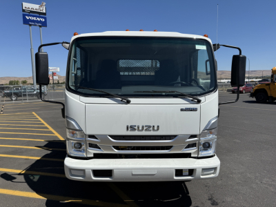 Isuzu NQR-GAS flatbed trucks front view showing Isuzu emblem and grille with large windshield and side mirrors.