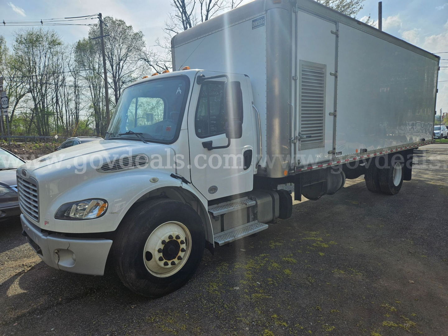 Freightliner M2 106 cab and box truck in-service showing front and side profile with cab doors and dual rear wheels