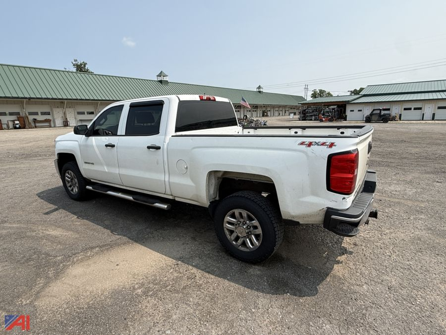 2016 Chevrolet Silverado 2500HD Crew Cab pickup truck with white paint, four doors, crew cab, short bed, 4x4 badge on rear quarter.