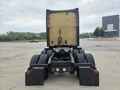 Kenworth T680 rear view showing chassis and dual rear axles with mud flaps and hitch, no trailer attached.