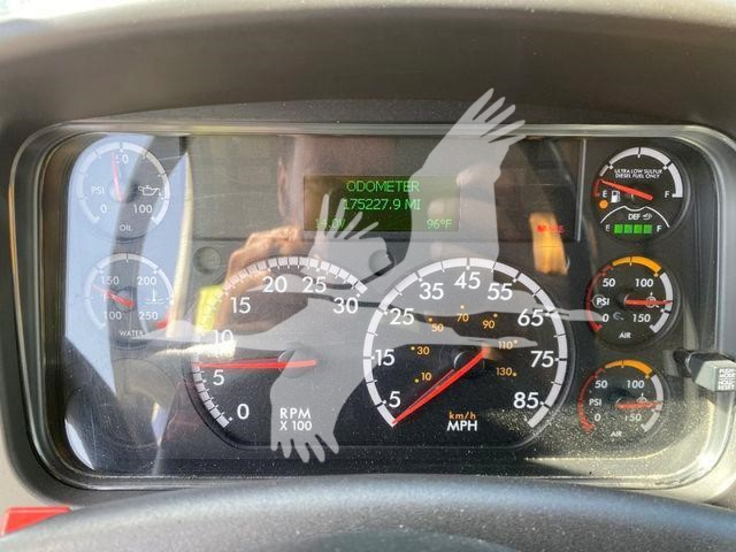 Dashboard of a Freightliner M2 106 showing instrument cluster with RPM, speedometer, and odometer display. Odometer reads 75227.9 miles. Various gauges including fuel, air pressure, and engine indicators.