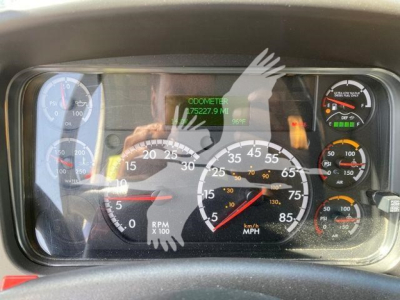 Dashboard of a Freightliner M2 106 showing instrument cluster with RPM, speedometer, and odometer display. Odometer reads 75227.9 miles. Various gauges including fuel, air pressure, and engine indicators.