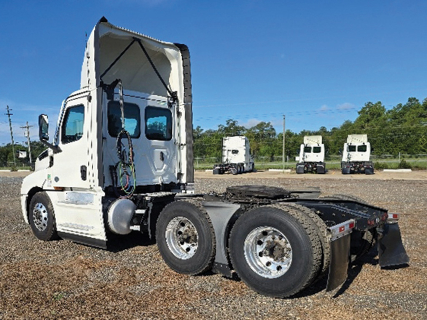 Truck chassis with raised sleeper cab and exposed rear axles, Freightliner Cascadia126, VIN 3AKJHLDV0PSNT4531 visible in listing.