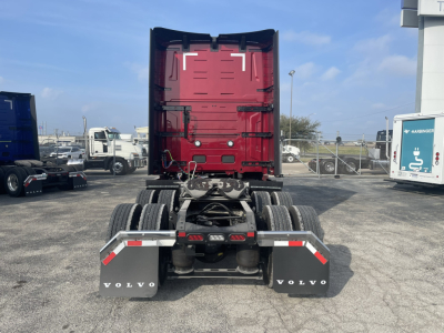 Volvo VNL64T860 tractor rear view showing dual rear axles and fifth-wheel connection.