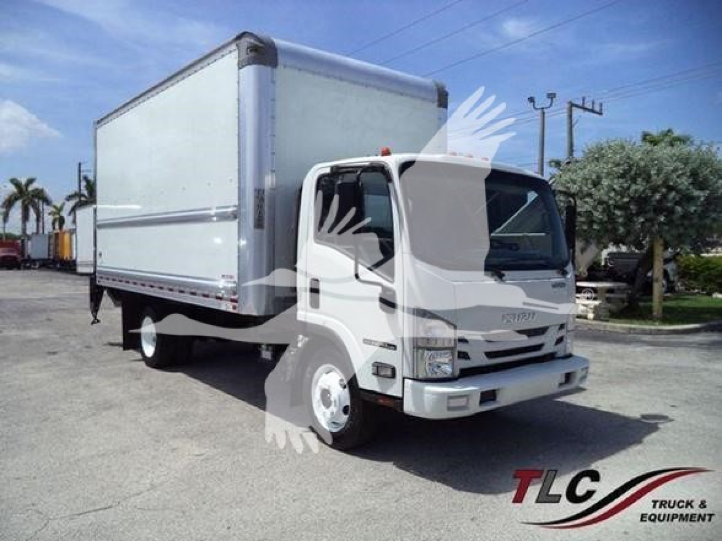 Isuzu NPR-HD box truck with cargo box, front cab, HALO logo watermark. Visible text on ad not fully readable from vehicle; no license plate.