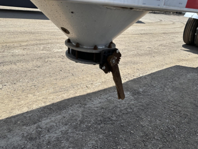 Pneumatic gravity drop trailer bottom hopper with valve lever and flange showing undercarriage, steel cone and valve stem.