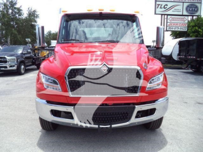 Front view of a red 2027 International MV rollback truck showing chrome grille, headlights, and bumper. VIN plate not visible.