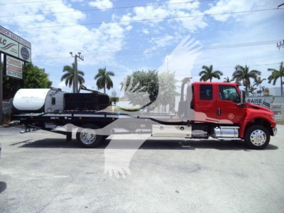 International MV tow truck with red cab and flatbed, VIN 1HTEUMML1VS478884, stock J78884, rollback category, new used truck.