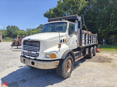 1998 Ford Louisville 9500 Dump Truck side/front view showing dump bed and dual rear wheels.