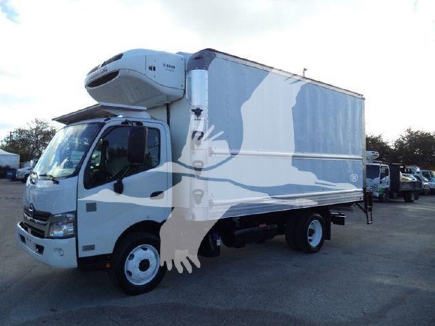 Truck refrigeration unit on a 2020 Hino 195 refrigerated box truck showing cargo area with side graphics and liftgate.