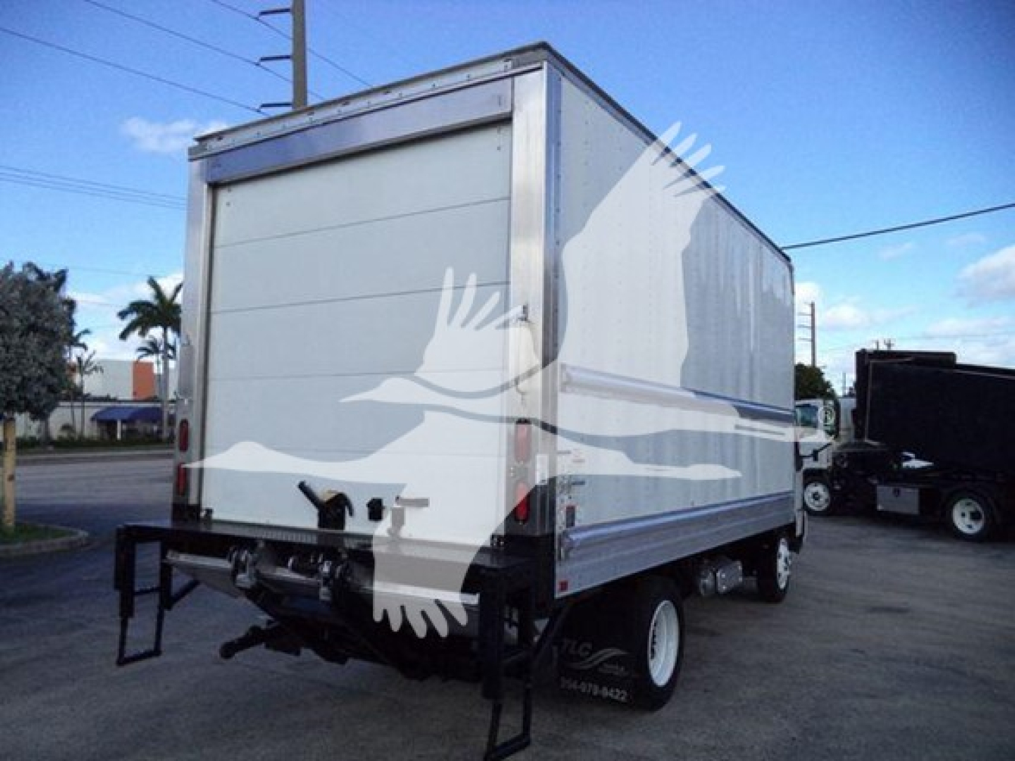 Refrigerated box truck rear/view showing side, with tailgate and rear bumper.