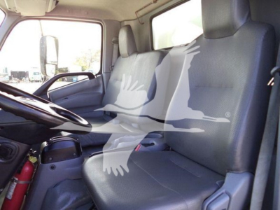 Cab interior of a 2020 Hino 195 refrigerated truck showing driver seat and passenger seat.