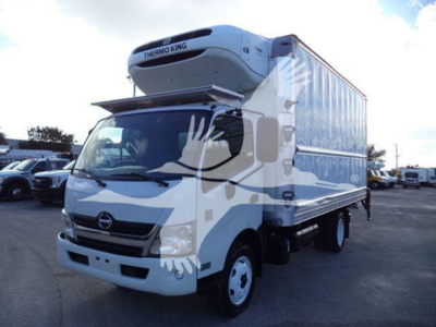 Hino 195 refrigerated truck with Thermo King unit on top, white cab and box, side view showing refrigeration unit and cargo box.