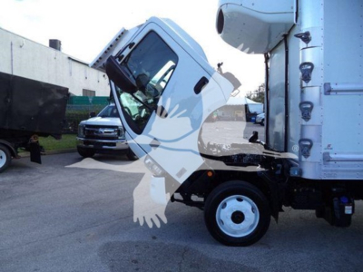 Truck cab of a 2020 Hino 195 refrigerated truck showing front wheel and cab tilt with GPS antenna on top and side mirrors.