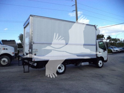 Hino 195 refrigerated truck side view showing cab, box, and white wheels with no visible branding text.