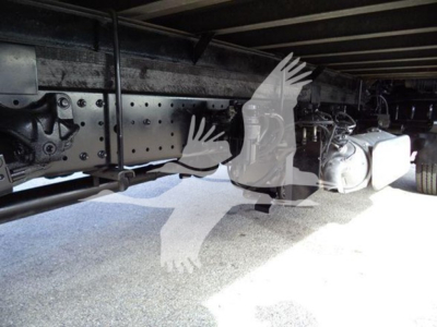 Chassis underside of a 2020 Hino 195 refrigerated truck showing frame rails, axle components, and underbelly hardware.
