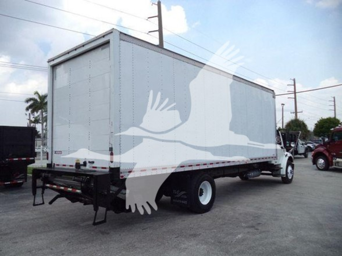 Freightliner M2 106 box truck showing side view with cab and cargo box
