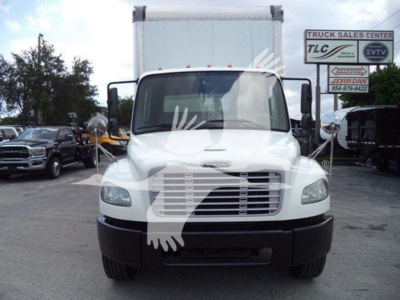 Truck front view of a white 2020 Freightliner M2 106 with box body, cab mirrors, grille, and headlights visible.