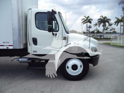 Freightliner M2 106 truck cab side view with box trailer, showing front wheel, door, and side mirror.