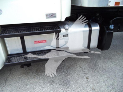 Truck side showing fuel tank and step area of Freightliner M2 106 with steps and tank markings.