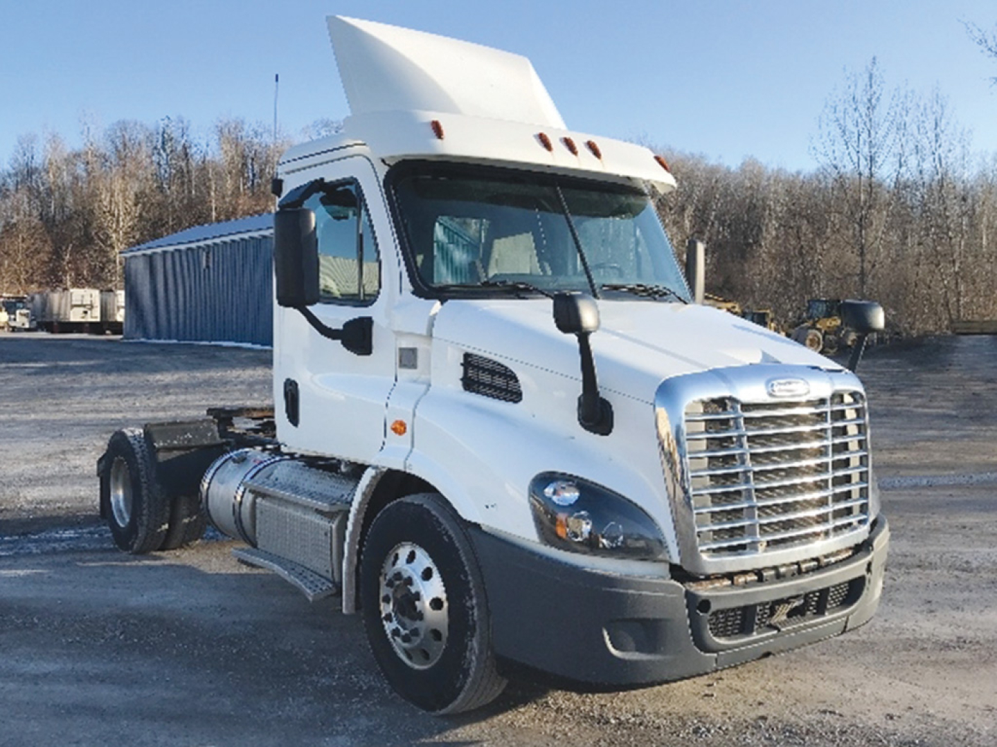 White 2018 Freightliner Cascadia 113 conventional daycab truck in daylight, side view showing cab, grille, front tires, and sleeper area with VIN/stock not visible.