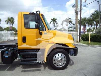 2019 International 4300 rollback truck side view showing cab and front wheel.
