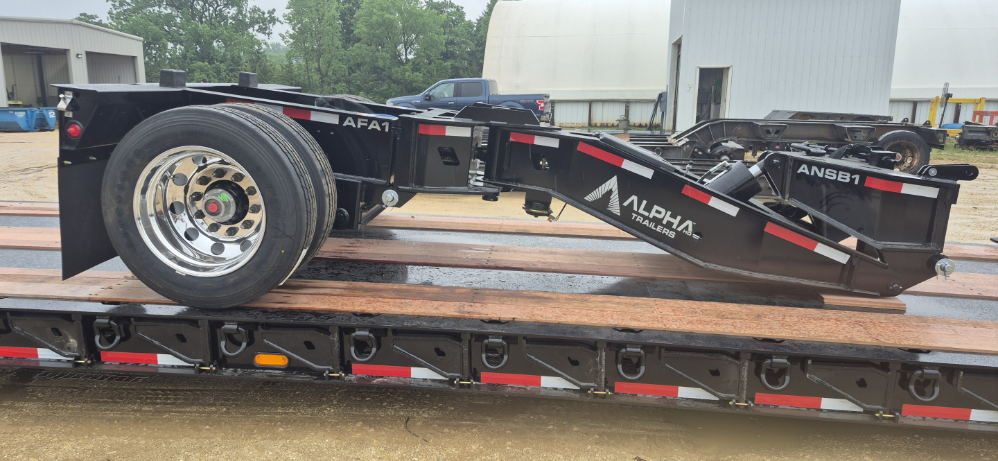 Alpha ANSB1 Nitro Spreader Bar trailer showing 55 Ton capacity, 8'6" width, long lowboy chassis, wheel and support beams visible.