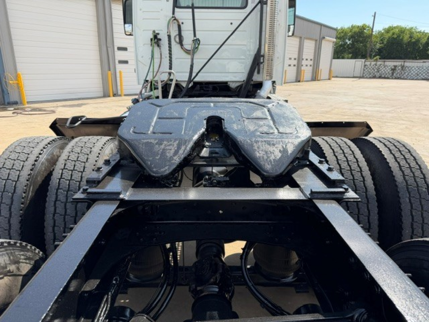 Volvo VNR64T300 tractor chassis view showing rear frame and fifth wheel area with dual rear axles and suspension components.