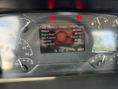 Volvo VNR dashboard displaying vehicle totals: Mileage 457,449 mi; Engine Hours 3,679.6; Time in Service 53w 11d?; Fuel Used 2035 gal; Highest RPM 2201; N NE 2