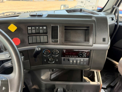 Volvo VNR64T300 truck dashboard and steering wheel area with instrument cluster and controls visible.