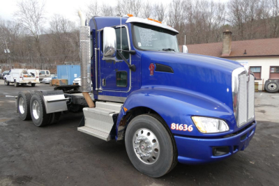Kenworth T660 truck in blue paint showing front-left view with sleeper cab and wheel dual rear axles.
