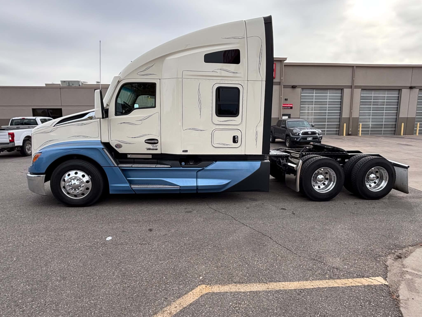 Kenworth T680 side view truck with sleeper cab, showing the cab doors and wheels, no visible labels from the image.