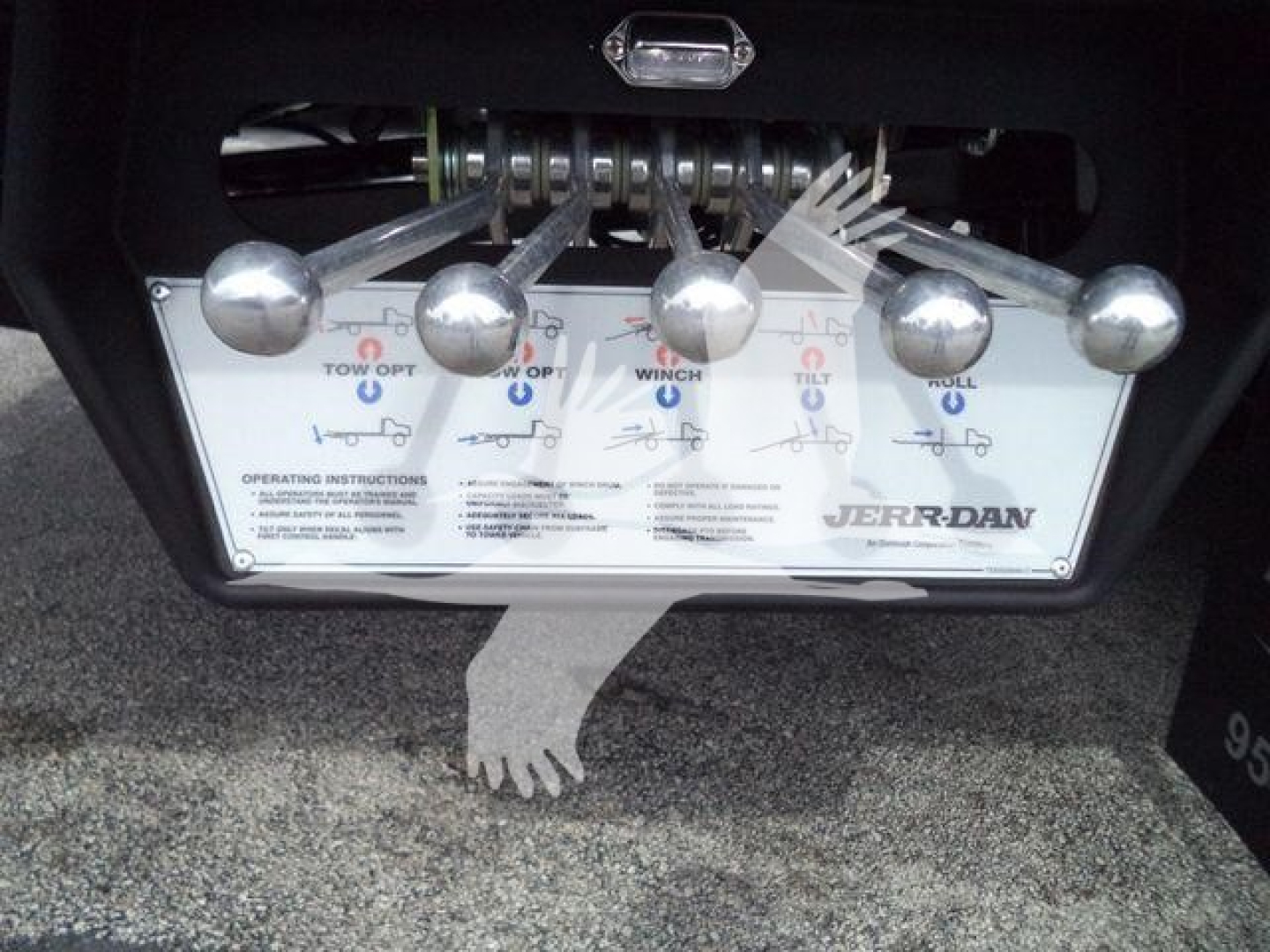 Kenworth T280 rollback control panel with multiple levers and labels showing operational instructions and Jerr-Dan branding.