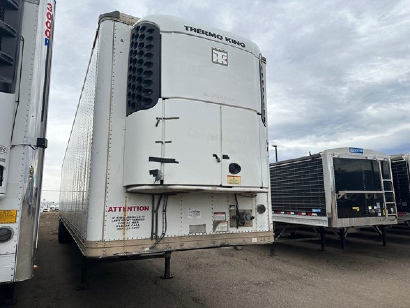 Great Dane 2014 roll-door refrigerated trailer with Thermo King unit, front view showing 'Thermo King' branding and access doors.