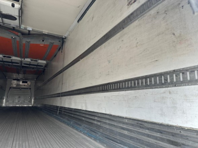 Great Dane trailer reefer interior with roll door, long cargo area, metal side walls, and tracked rails