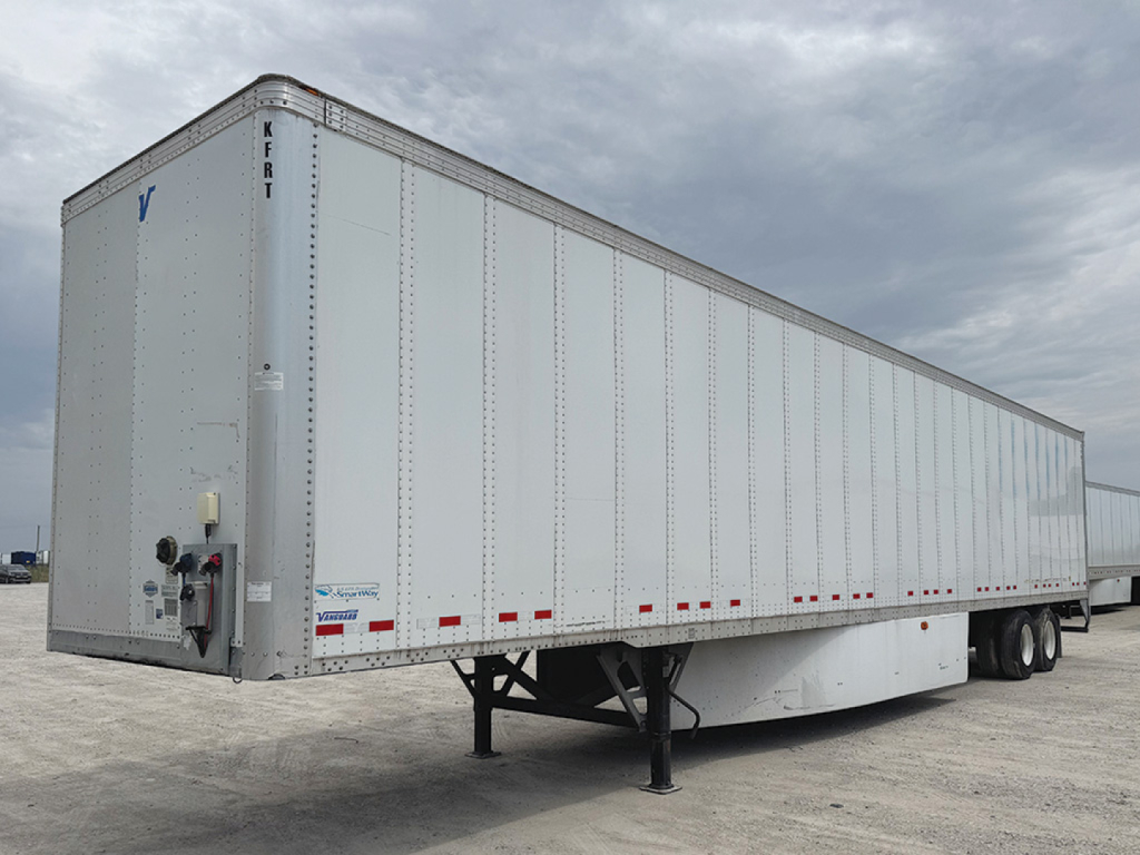 Trailer side view of a Vanguard VXP box trailer with landing gear and dual rear axles.