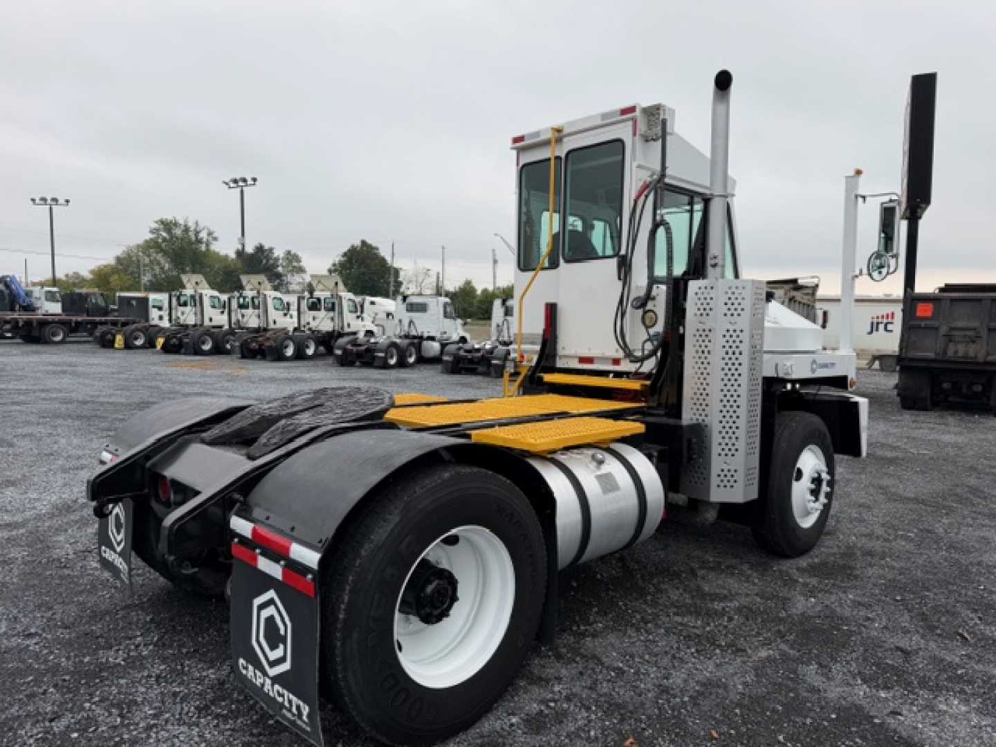 Capacity TJ5000 yard truck tractor rear view showing cab and fifth wheel with fuel tank and chassis; DOT equipment.
