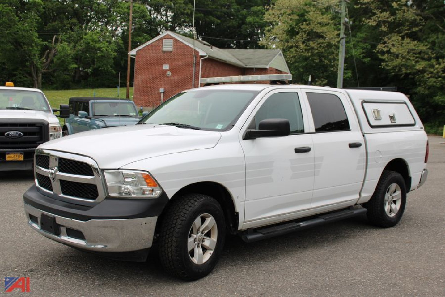 Ram 1500 crew cab pickup with cap, white, 4x4, front three-quarter view showing side steps