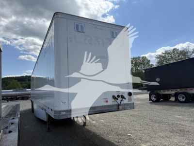 Trailers showing the rear of a white Hyundai roll door trailer with support legs and bumper assembly visible.