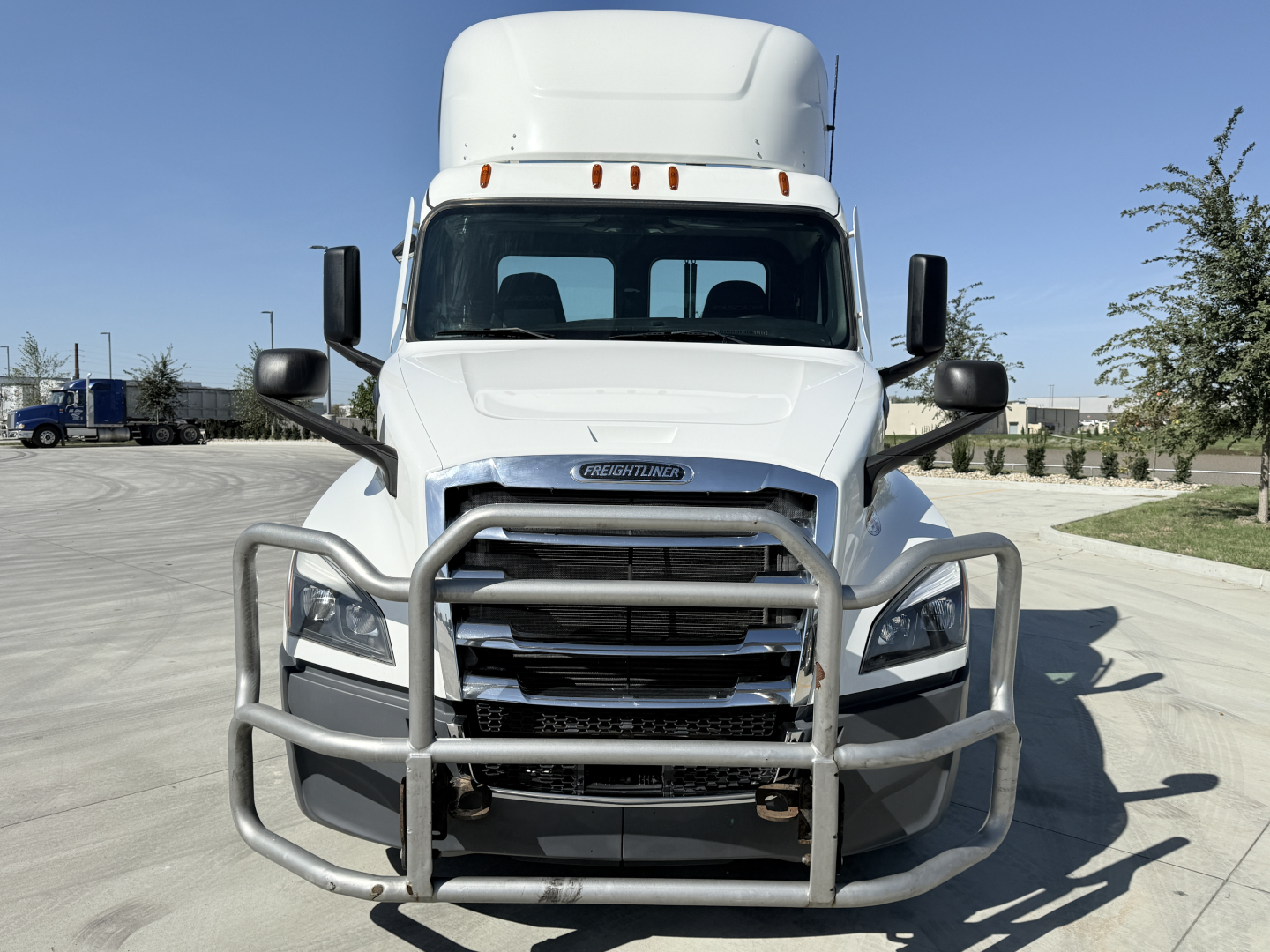 Front view of a 2021 Freightliner PT126064S T conventional daycab truck with grille guard and chrome bumper, showing Freightliner badge and front fascia.