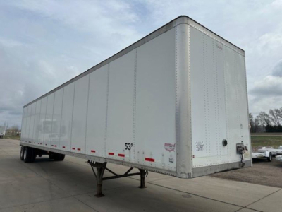 Semi trailer trailer box with 53' length markings, rear doors, and support legs visible. Side shows a few red reflective dots along the bottom edge.