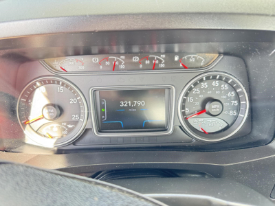 Dashboard view of a 2019 International LT showing instrument cluster with center digital display reading 321,790 miles, left tachometer, right speedometer, and various gauges.