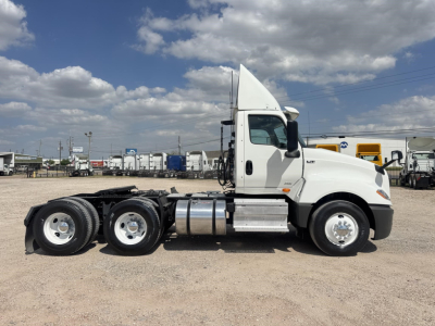 2019 International LT tractor side view showing cab and dual rear axles with fuel tanks and exhaust.