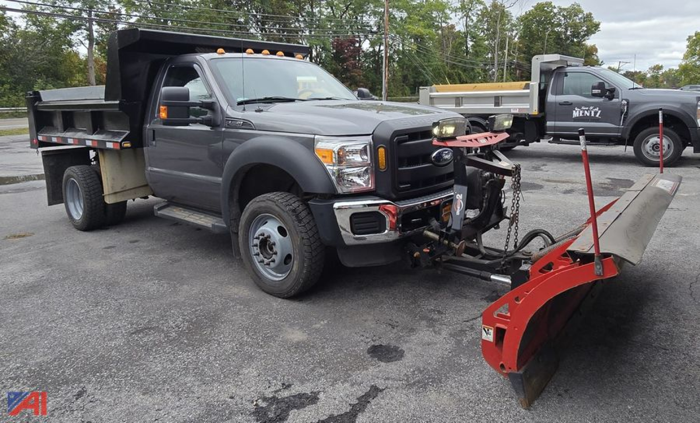 Ford F-450 XL Super Duty dump truck with plow, front-mounted snow plow attachment, gray cab, dump bed, dual rear wheels, VIN 1FDUF4HY5DEB32192