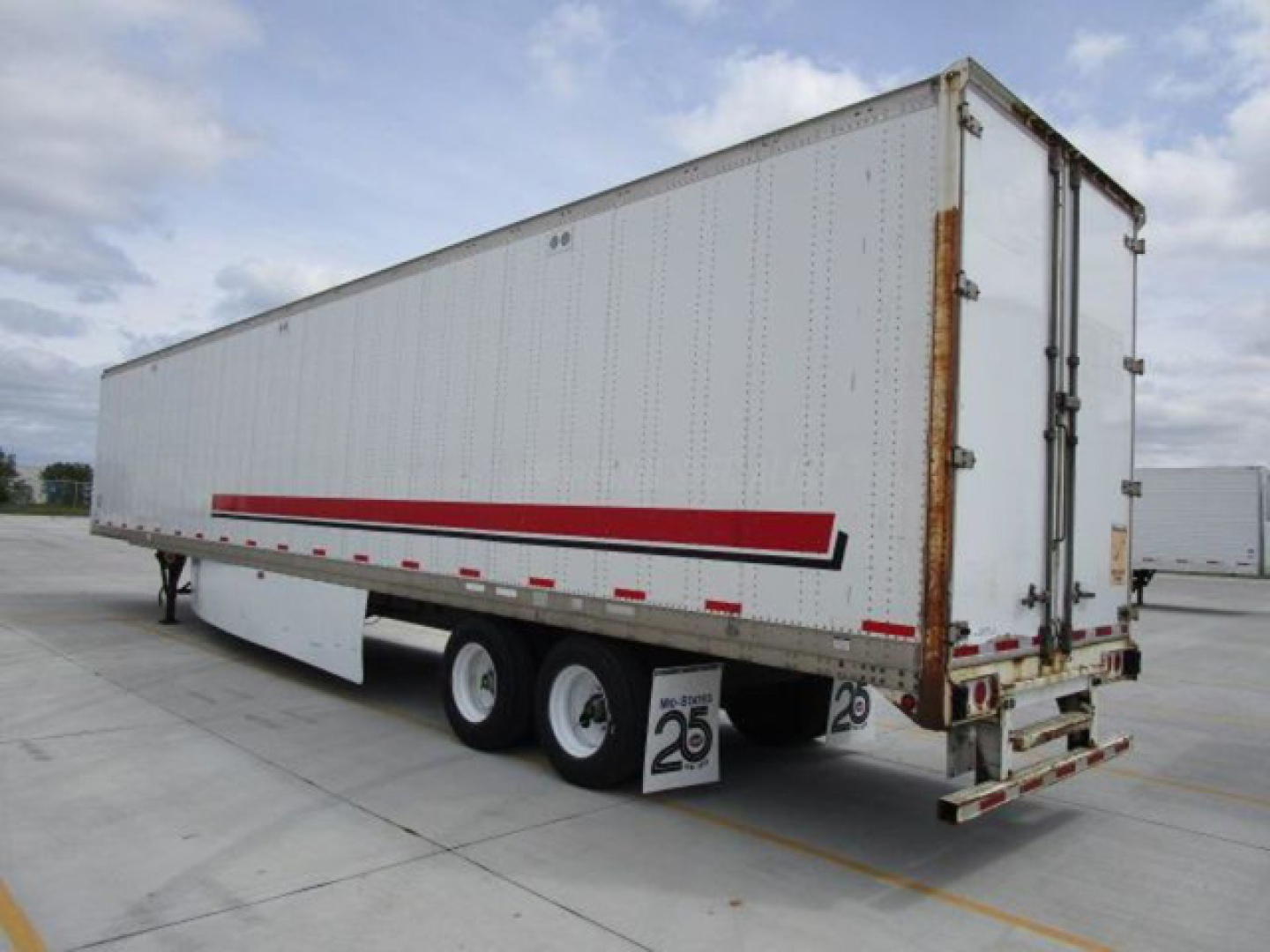 2014 Stoughton van trailer showing side and rear with red stripe graphics and dual rear wheels.