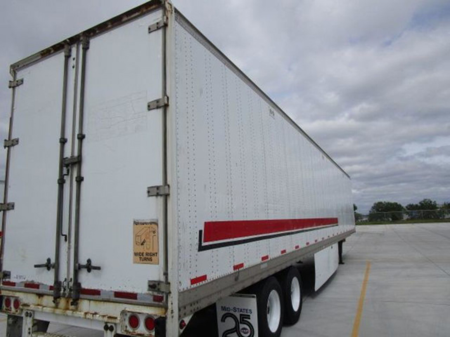 Stoughton van trailer side and rear doors showing white sides with red reflective strip and dual rear doors.