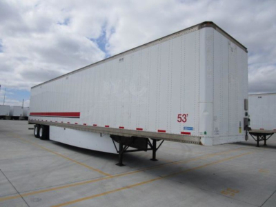 Stoughton van trailer showing side and front, white exterior, red reflective stripe, 53' length, trailer undercarriage with dual rear axles visible.