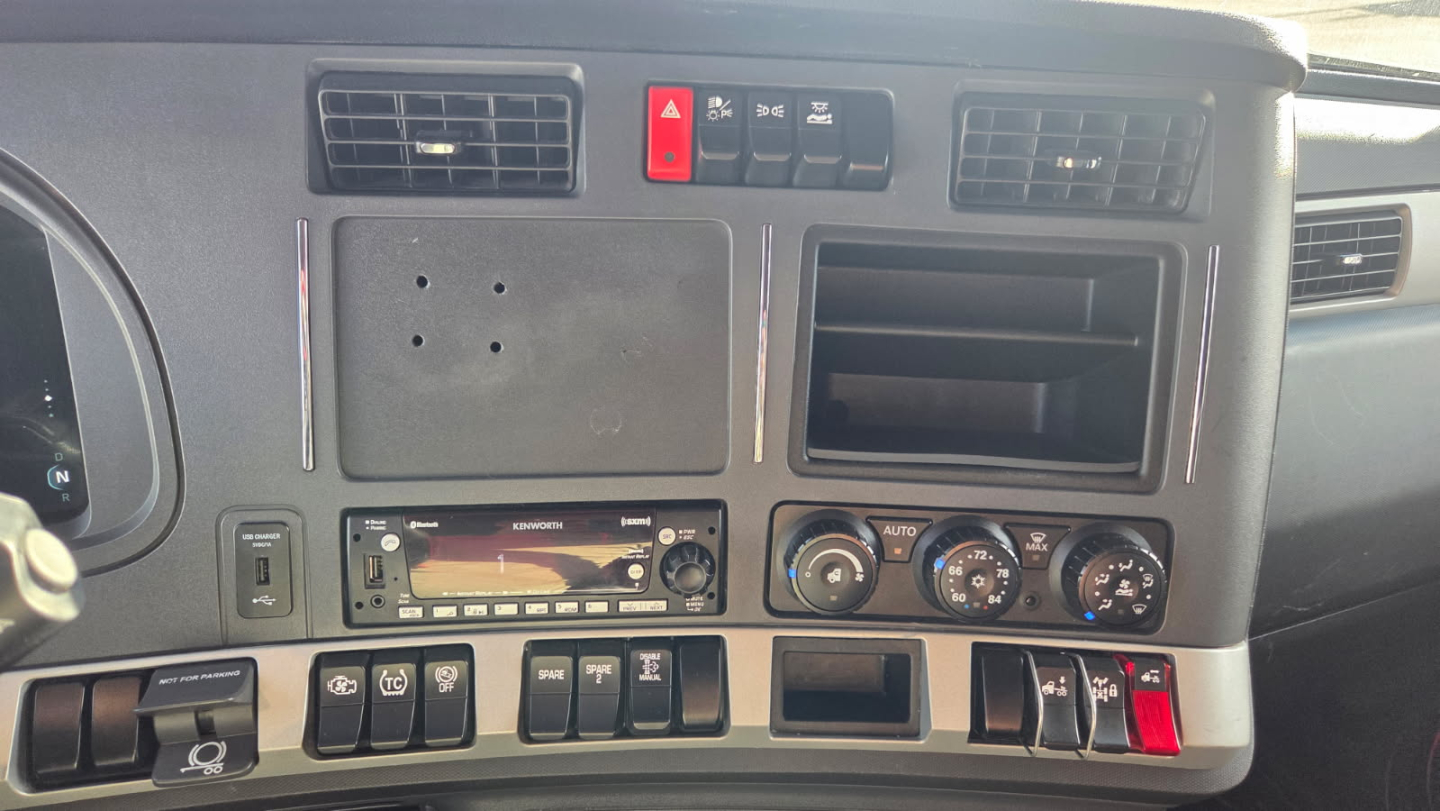 Kenworth T680 dashboard and center console showing HVAC controls and dash vents