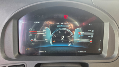 Kenworth T680 instrument cluster display showing digital gauges in a truck cockpit