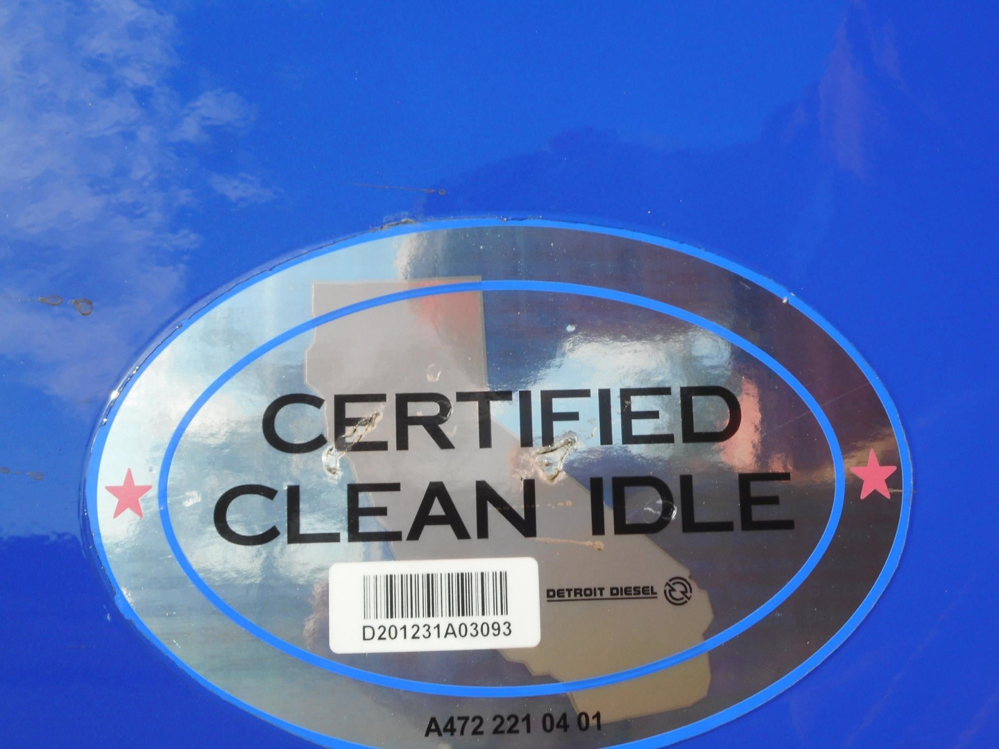 Freightliner Cascadia 126 engine bay area with Certified Clean Idle badge and barcode sticker visible.
